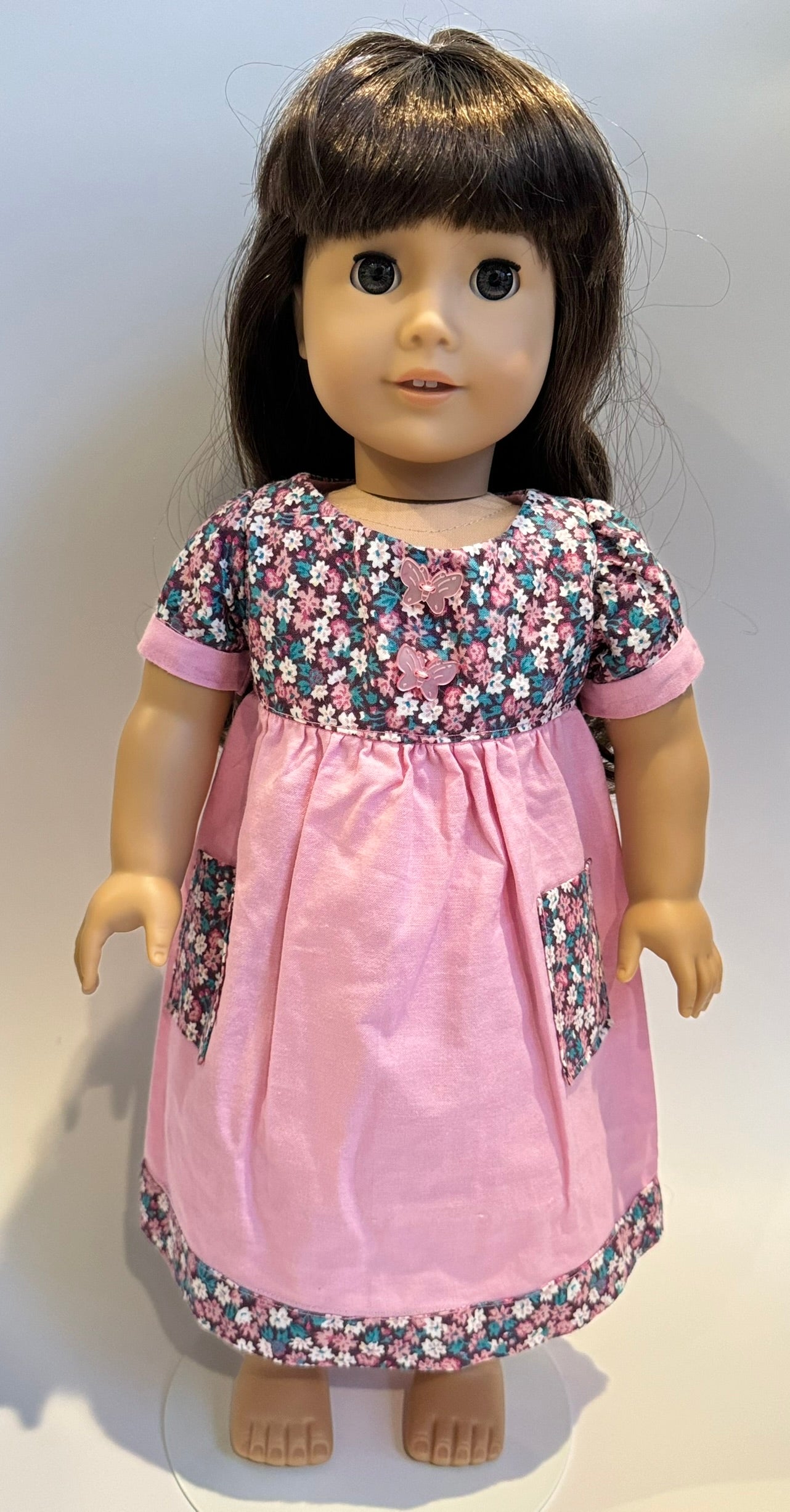 Dress made by Kathleen Saviak: pink floral with pockets and butterfly buttons