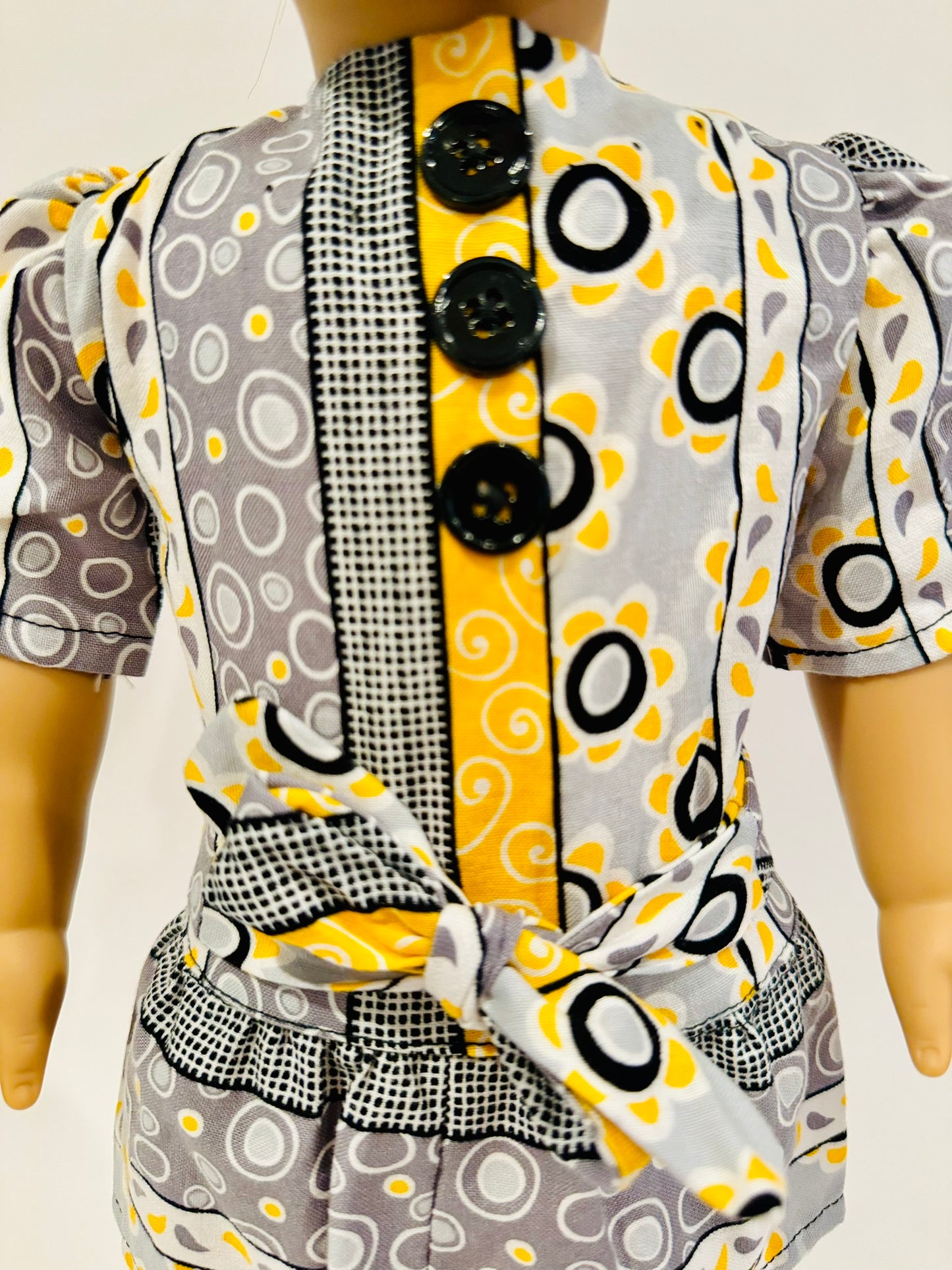 Dress made by Kathleen Saviak: whimsical yellow, gray, black, and white