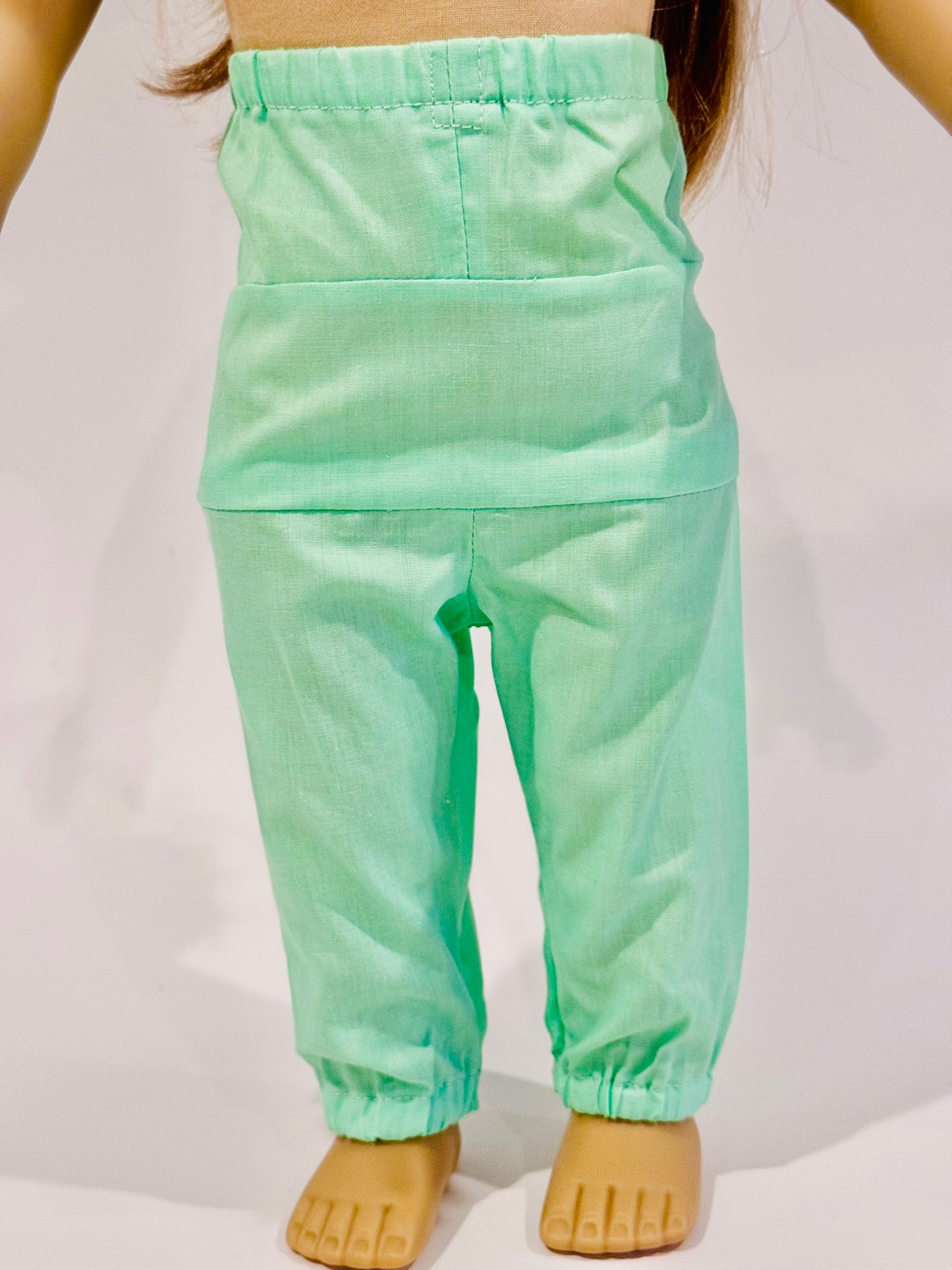 2-piece outfit made by Kathleen Saviak: mint green flowy and flowery top and slacks