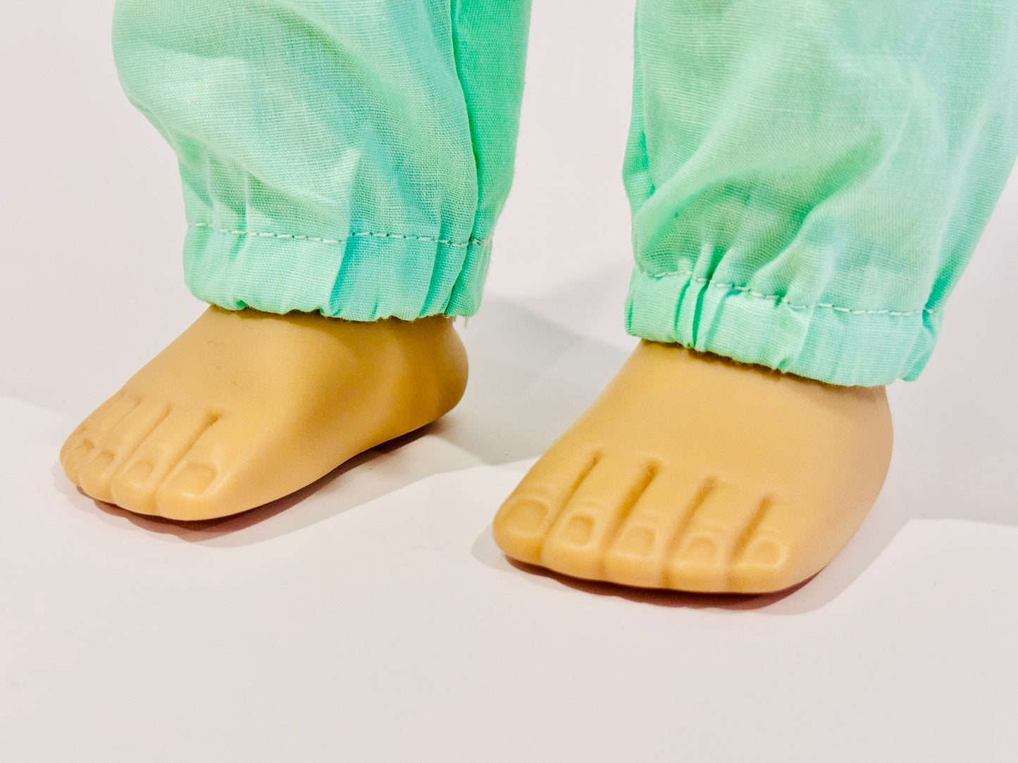 2-piece outfit made by Kathleen Saviak: mint green flowy and flowery top and slacks