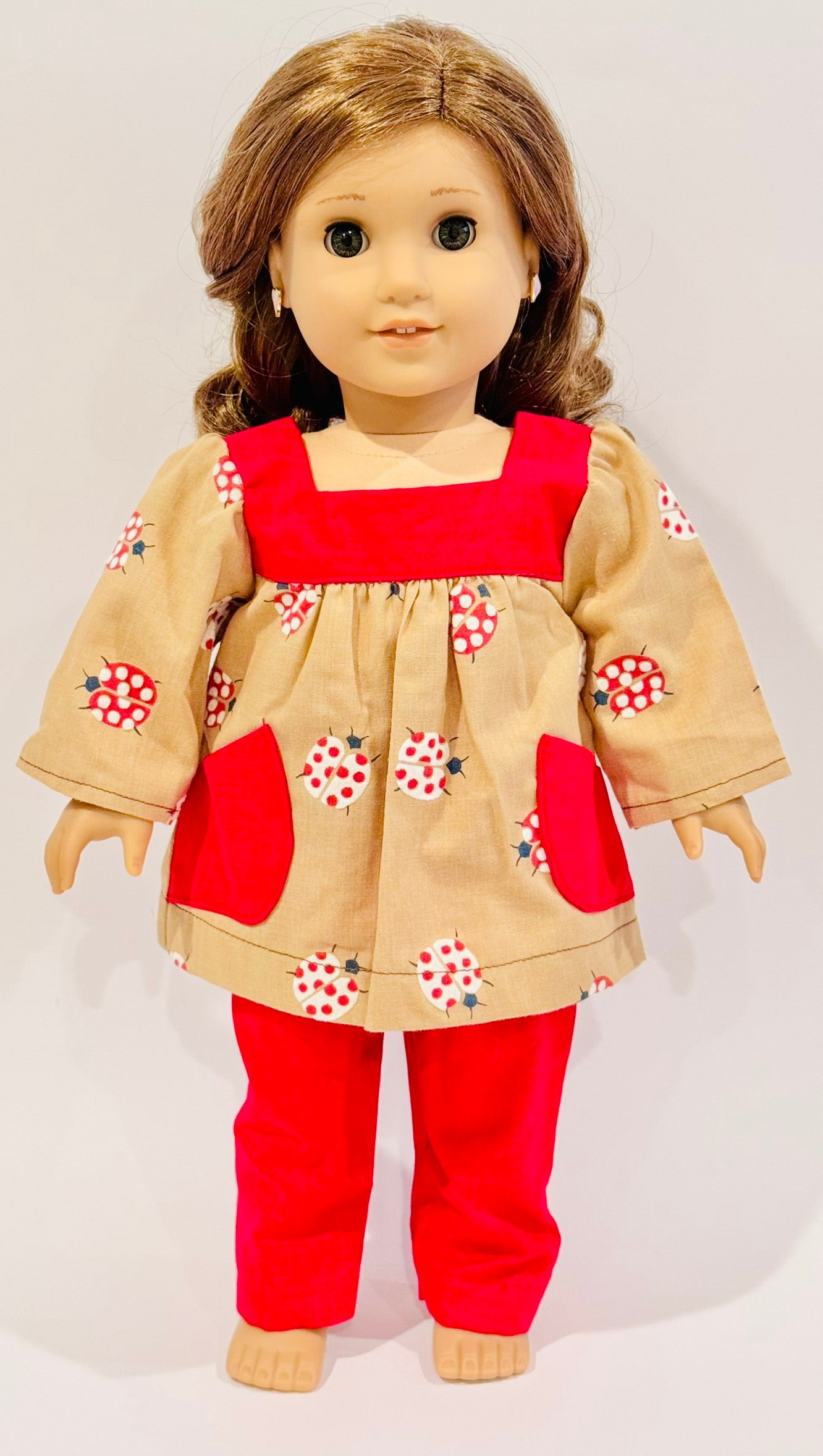 2-piece outfit made by Kathleen Saviak: ladybug top with pockets and red slacks