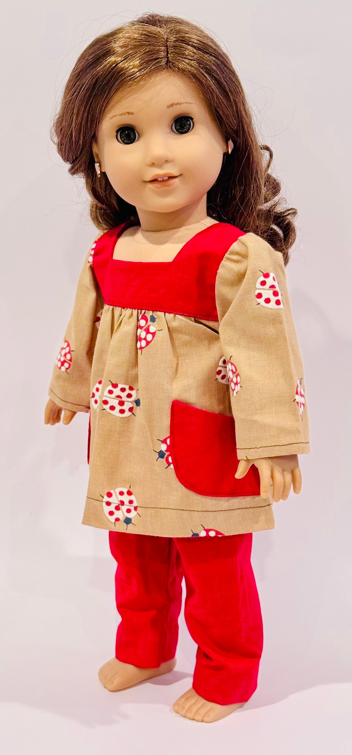 2-piece outfit made by Kathleen Saviak: ladybug top with pockets and red slacks