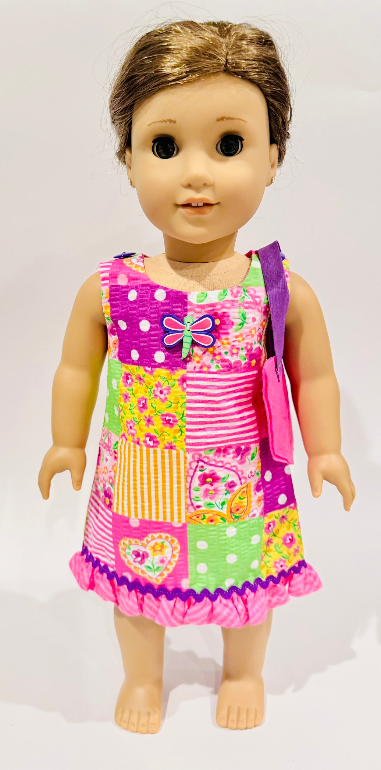 Dress and purse made by Kathleen Saviak: pink dragonfly patchwork quilt