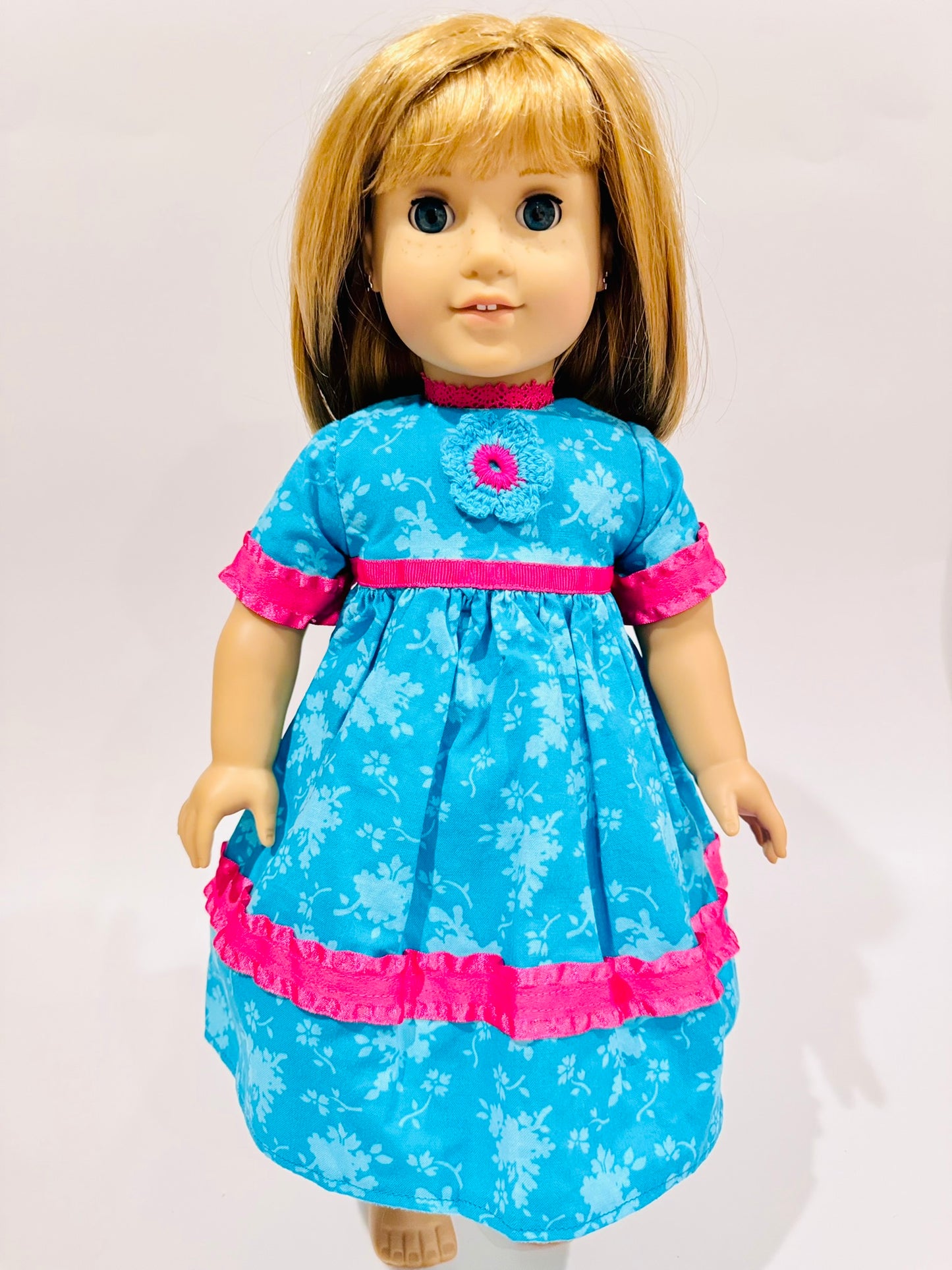 Dress made by Kathleen Saviak: blue and hot pink with crochet flower