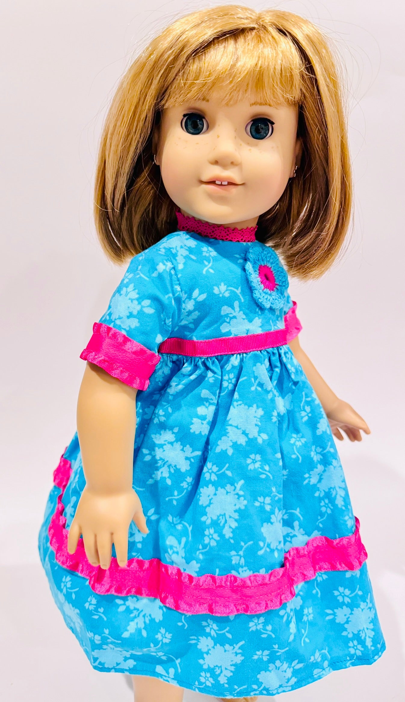 Dress made by Kathleen Saviak: blue and hot pink with crochet flower