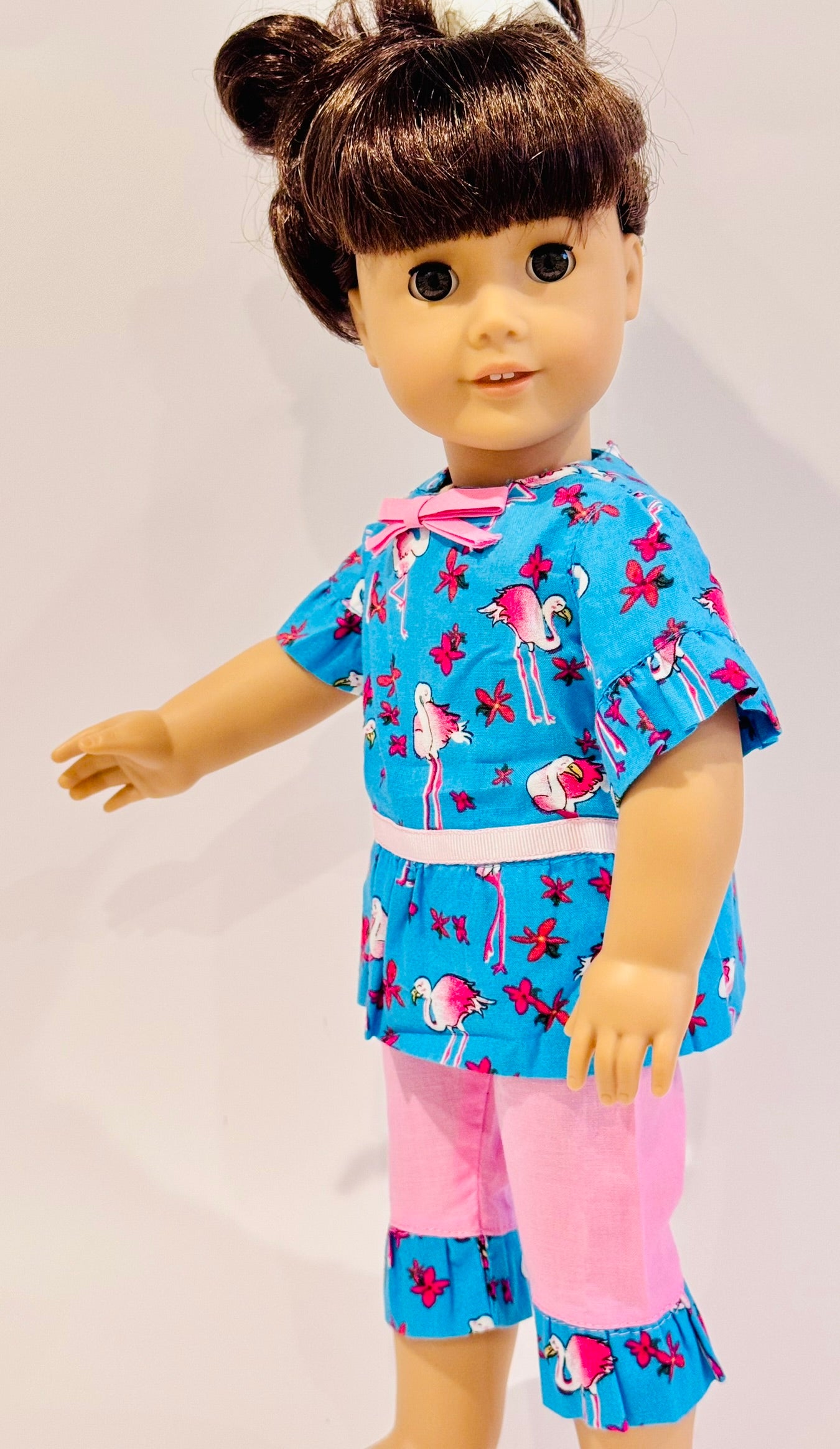2-piece outfit made by Kathleen Saviak: blue and pink flamingo ruffled top and capris