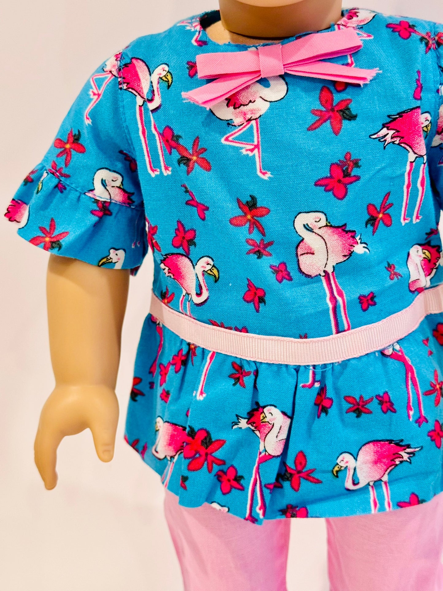 2-piece outfit made by Kathleen Saviak: blue and pink flamingo ruffled top and capris