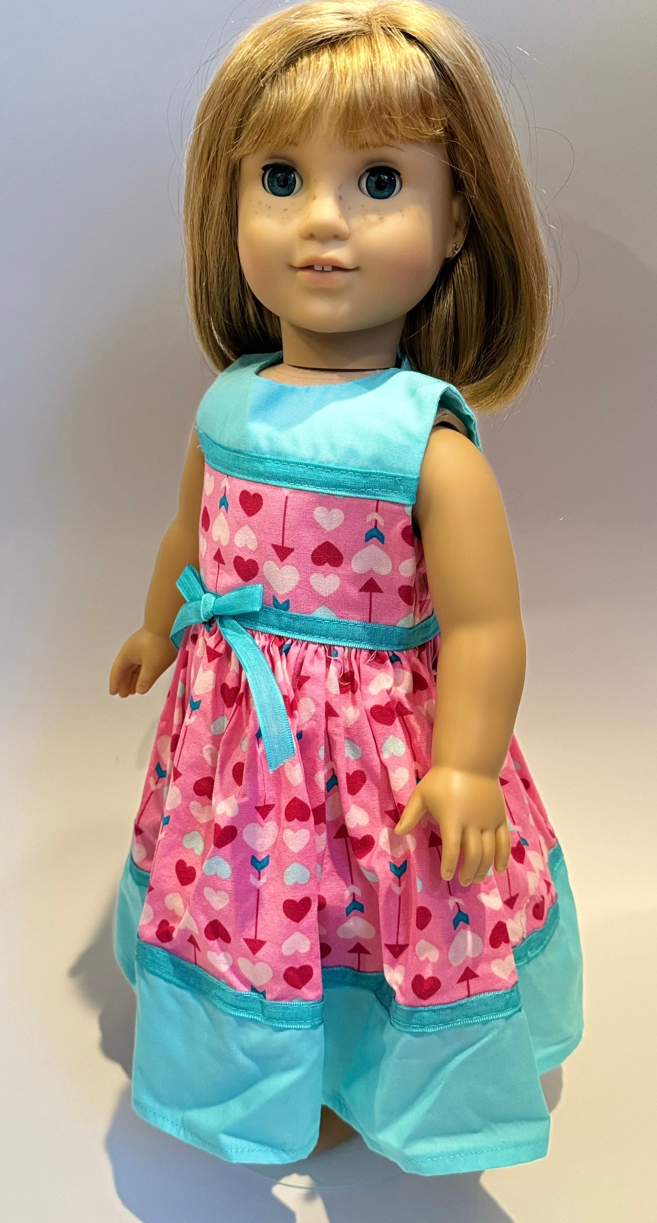 Dress made by Kathleen Saviak: pink Valentine arrows with blue accents