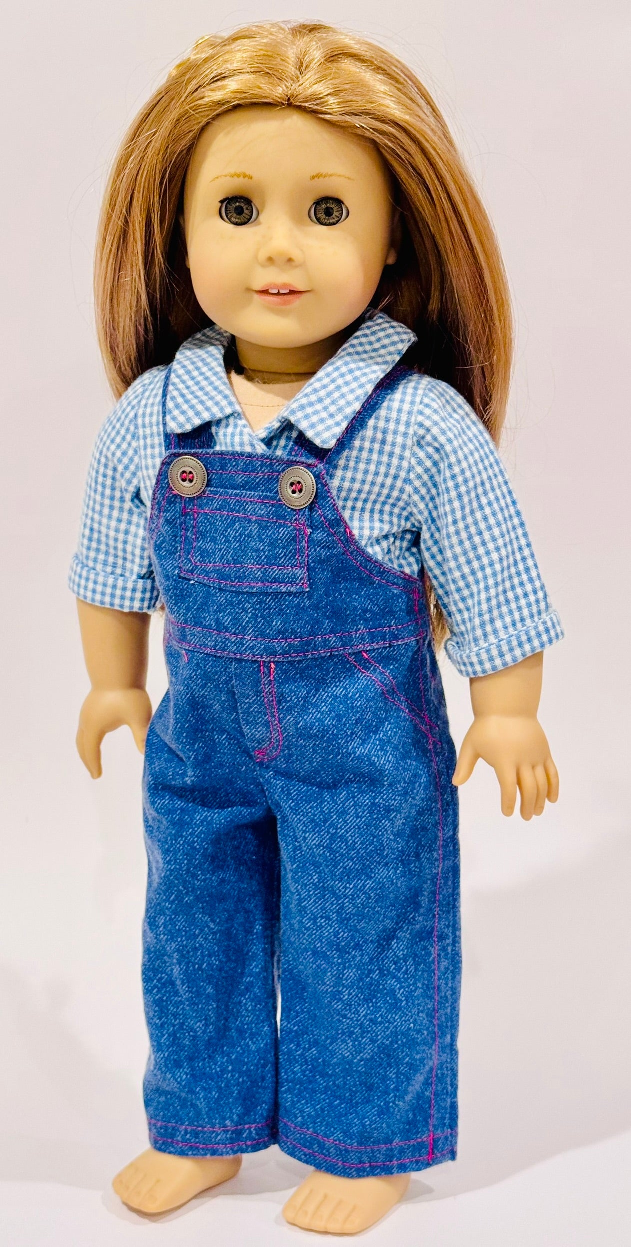 2-piece outfit made by Kathleen Saviak: blue jean overalls with gingham undershirt