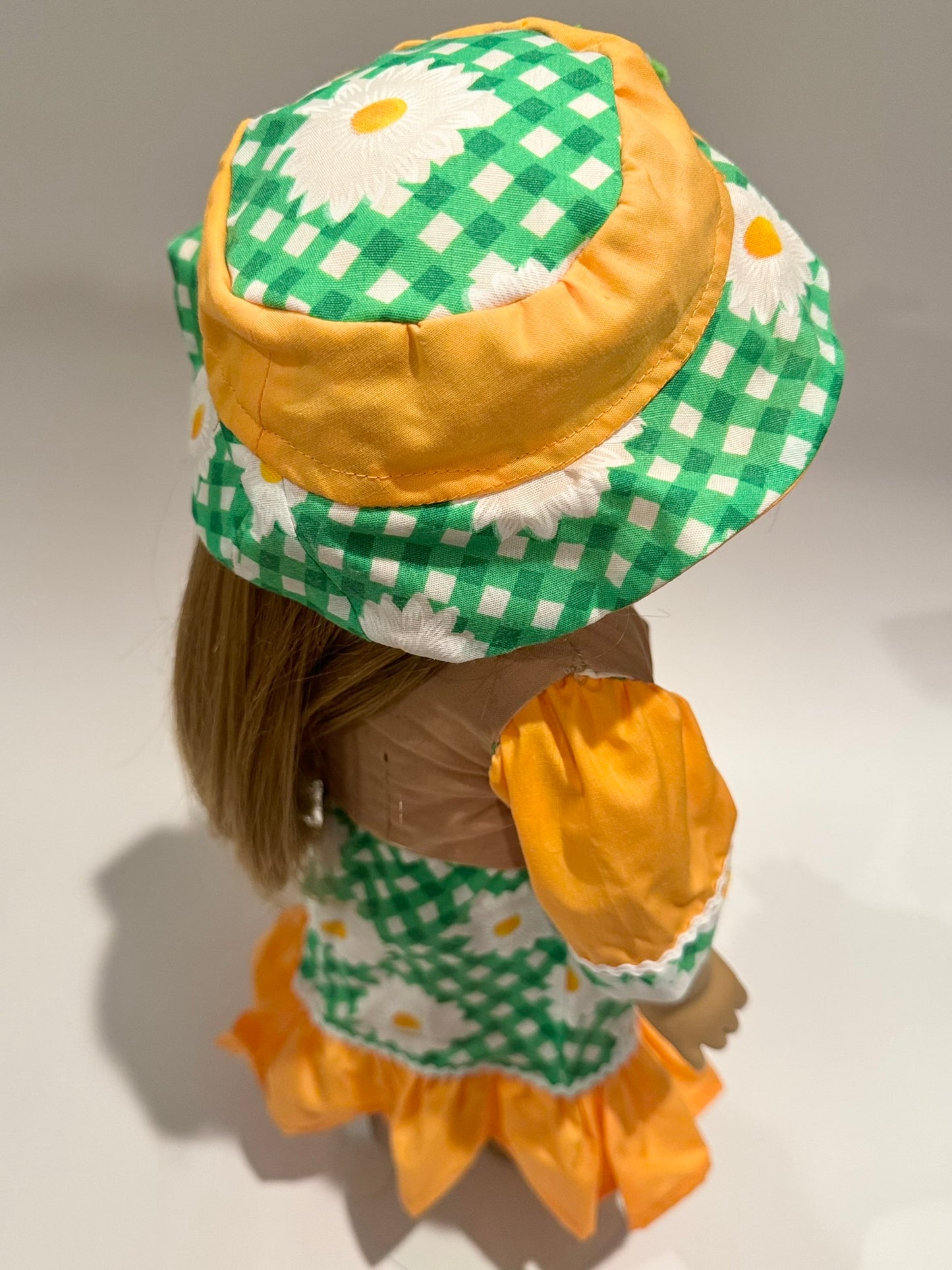 3-piece outfit made by Kathleen Saviak: orange and green daisies