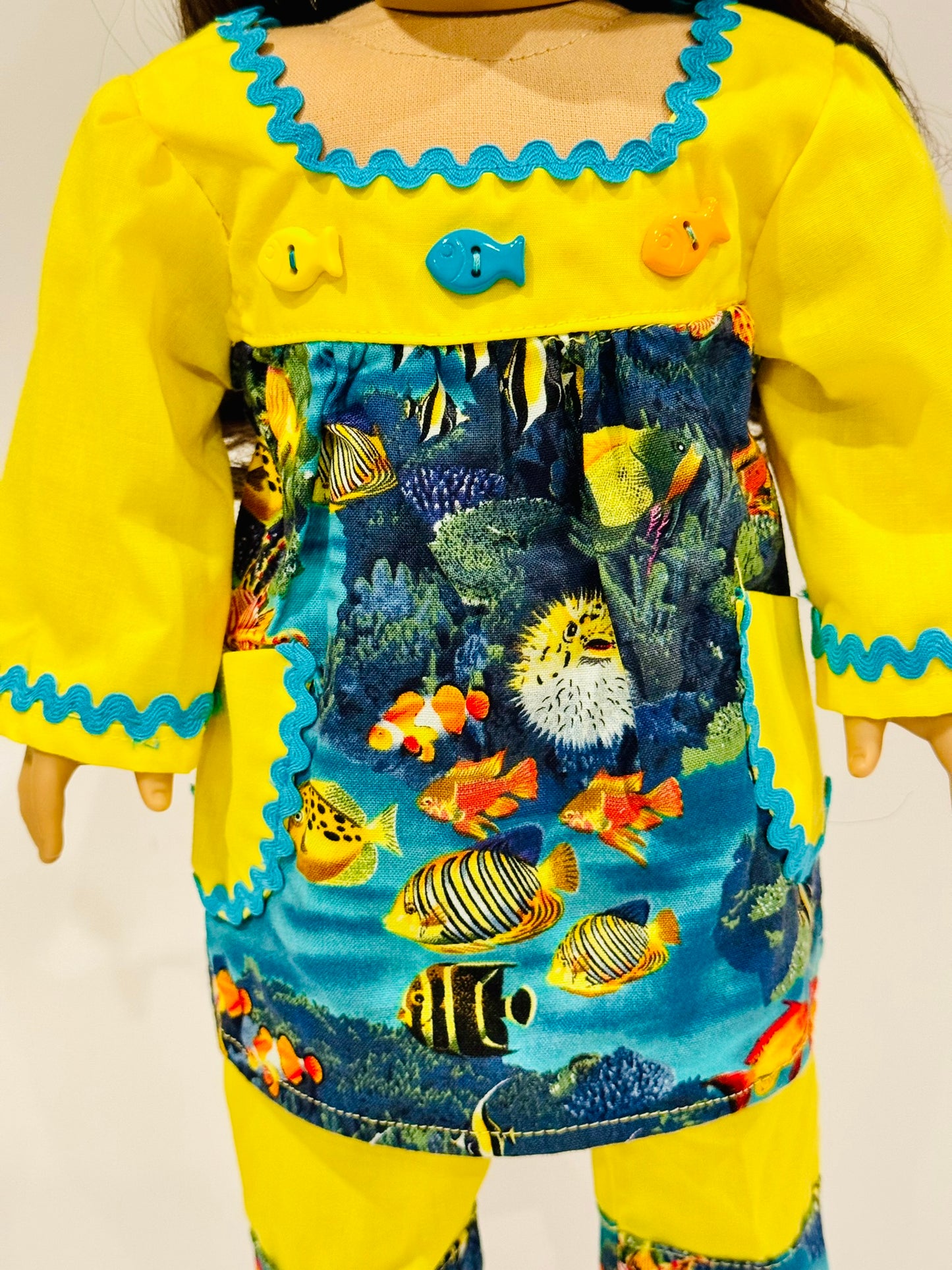 2-piece outfit made by Kathleen Saviak: yellow and blue ocean top and slacks
