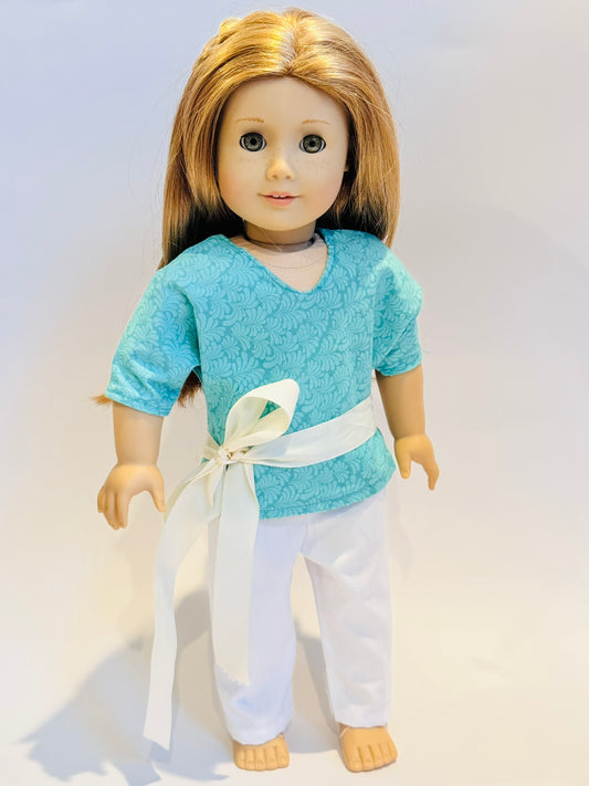 3-piece outfit made by Kathleen Saviak: aqua frill top with white slacks and coordinating ribbon
