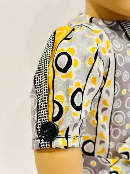 Dress made by Kathleen Saviak: whimsical yellow, gray, black, and white