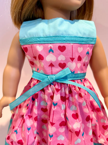 Dress made by Kathleen Saviak: pink Valentine arrows with blue accents